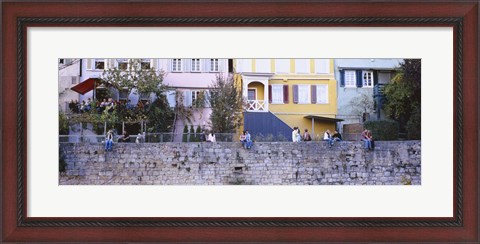 Framed Low Angle View Of A Group Of People Sitting On A Wall, Tubingen, Baden-Wurttemberg, Germany Print