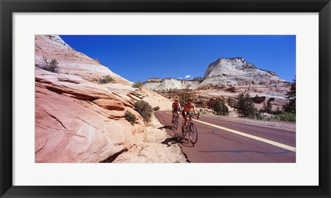 Framed Two people cycling on the road, Zion National Park, Utah, USA Print