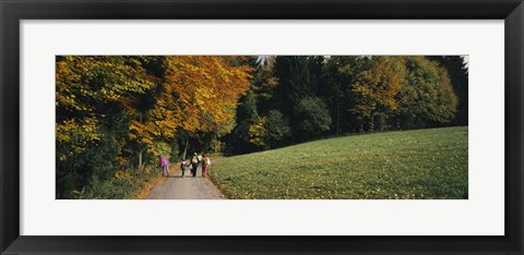 Framed Group of people walking on a walkway in a park, St. Peter, Black Forest, Baden-Wurttemberg, Germany Print