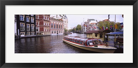 Framed Tourboat in a channel, Amsterdam, Netherlands Print