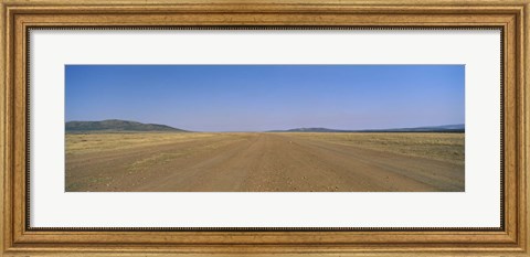 Framed Dirt road passing through a landscape, Masai Mara National Reserve, Great Rift Valley, Kenya Print