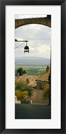 Framed Umbrian countryside viewed through an alleyway, Assisi, Perugia Province, Umbria, Italy Print