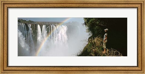 Framed Woman looking at a rainbow over the Victoria Falls, Zimbabwe Print