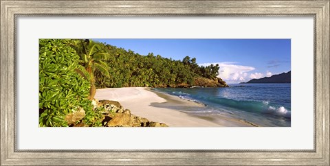 Framed Waves breaking on a small secluded beach on North Island, Seychelles Print