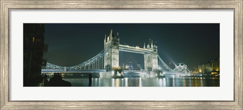 Framed Low angle view of a bridge lit up at night, Tower Bridge, London, England Print