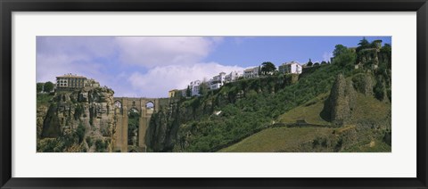 Framed Low angle view of a town, Tajo Bridge, Rio Guadalevin Gorge, Serrania De Ronda, Ronda, Andalusia, Spain Print