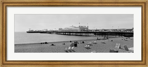 Framed Tourists on the beach, Brighton, England Print