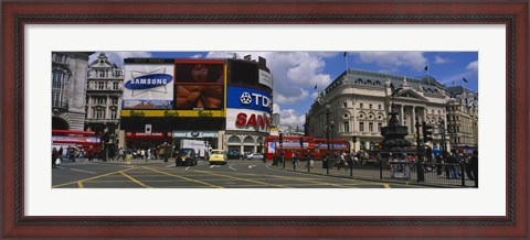 Framed Commercial signs on buildings, Piccadilly Circus, London, England Print