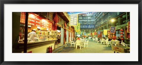 Framed Group of people sitting outside a restaurant, Beijing, China Print