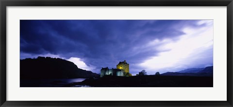 Framed Low Angle View Of A Castle Lit Up At Dusk, Eilean Donan Castle, Highlands, Scotland, United Kingdom Print
