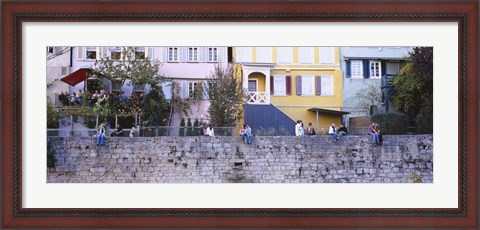 Framed Low Angle View Of A Group Of People Sitting On A Wall, Tubingen, Baden-Wurttemberg, Germany Print