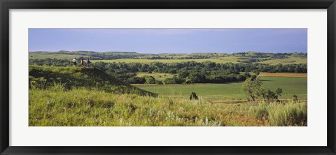 Framed Three mountain bikers on a hill, Kansas, USA Print