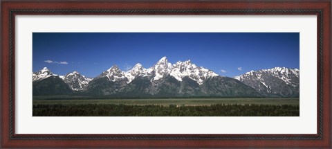 Framed Trees in a forest with mountains in the background, Teton Point Turnout, Teton Range, Grand Teton National Park, Wyoming, USA Print
