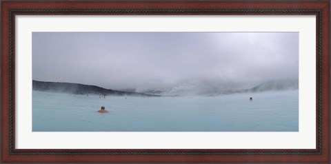 Framed Tourist swimming in a thermal pool, Blue Lagoon, Reykjanes Peninsula, Reykjavik, Iceland Print