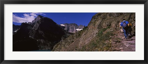 Framed Hikers hiking on a mountain, US Glacier National Park, Montana, USA Print