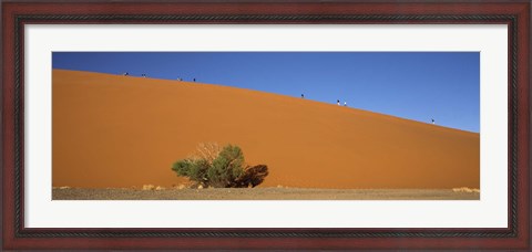 Framed Tourists climbing up a sand dune, Dune 45, Sossusvlei, Namib Desert, Namibia Print