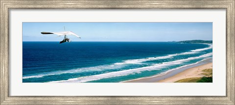 Framed Hang glider over the sea Print