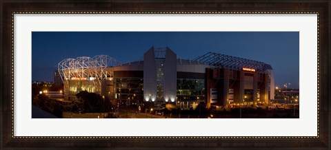 Framed Football stadium lit up at night, Old Trafford, Greater Manchester, England Print