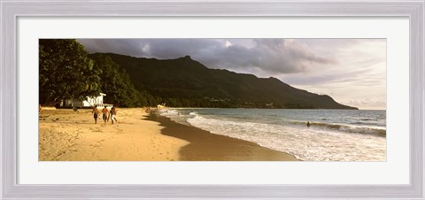Framed People walking along the Beau Vallon beach, Mahe Island, Seychelles Print