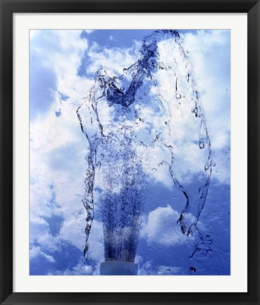 Framed Slow motion geyser of water rising through blue sky and clouds Print