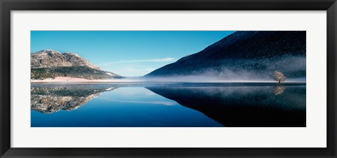 Framed Reflection of a mountain with snowy trees on a lake in winter afternoon, Cote d&#39;Azur, France Print