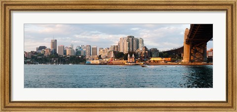 Framed Skyscrapers at the waterfront, McMahons Point, Sydney Harbor Bridge, Sydney Harbor, Sydney, New South Wales, Australia 2012 Print
