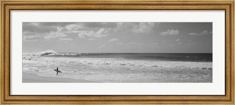 Framed Surfer standing on the beach in black and white, Oahu, Hawaii Print