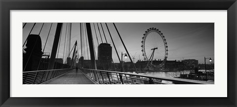 Framed Bridge across a river with a ferris wheel, Golden Jubilee Bridge, Thames River, Millennium Wheel, London, England Print