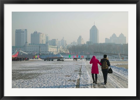 Framed Couple walking on a frozen river, Songhua River, Harbin, Heilungkiang Province, China Print