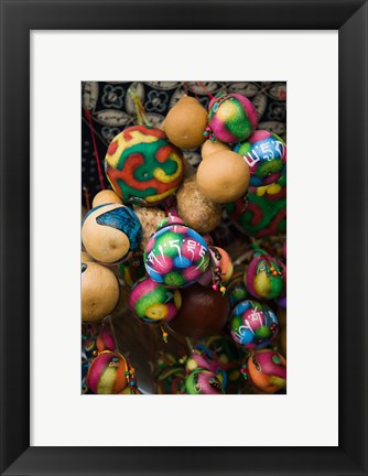 Framed Painted gourds for sale in a street market, Old Town, Lijiang, Yunnan Province, China Print