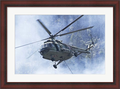 Framed Bulgarian Air Force Mi-17 helicopter over a forest fire in Bulgaria Print
