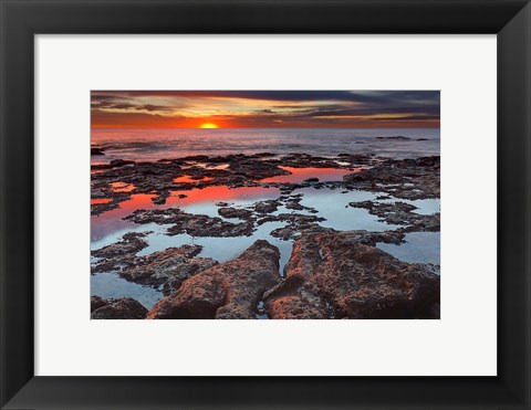 Framed Tidal pools reflect the sunrise colors during the autumn equinox Print