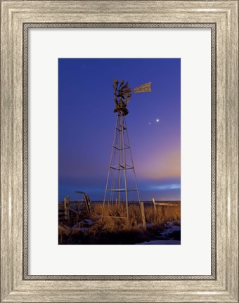 Framed Venus and Jupiter are visible behind an old farm water pump windmill, Alberta, Canada Print