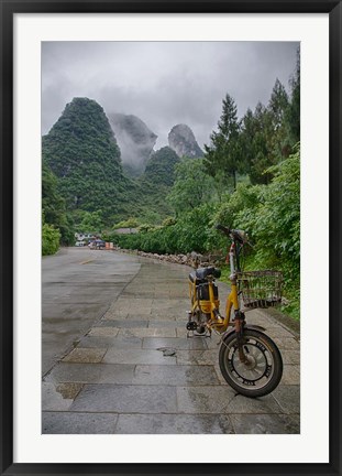 Framed Bicycle sits in front of the Guilin Mountains, Guilin, Yangshuo, China Print