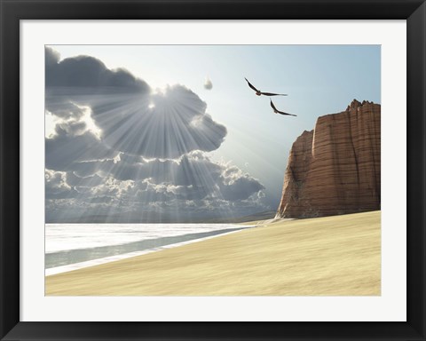 Framed Sunlight shines down on two birds flying near a cliff by the ocean Print