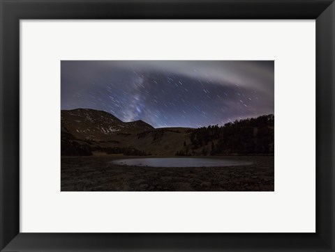 Framed Star trails and the blurred band of the Milky Way above a lake in the Eastern Sierra Nevada Print