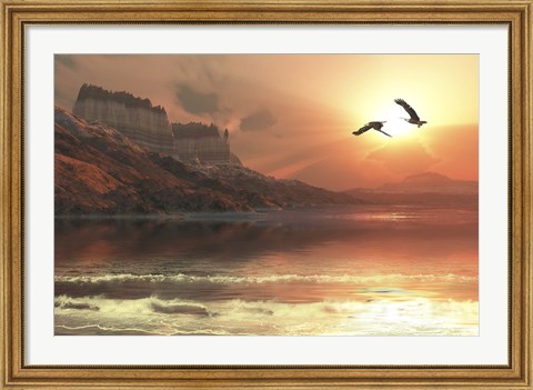 Framed Two Bald Eagles fly along a mountainous coastline at sunset Print