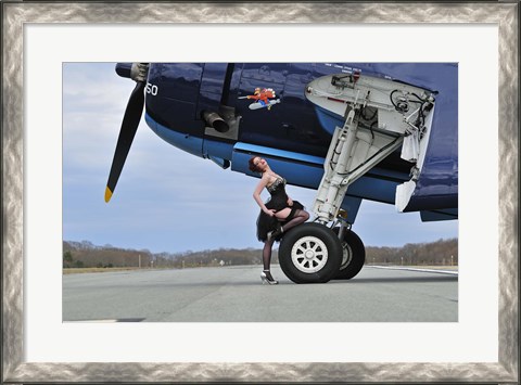 Framed 1940&#39;s style pin-up girl resting on the wheel of a TBM Avenger Print