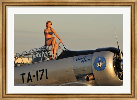 Framed 1940&#39;s style pin-up girl sitting on the cockpit of a World War II T-6 Texan Print