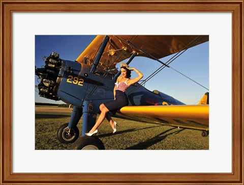 Framed 1940&#39;s style pin-up girl sitting on the wing of a Stearman biplane Print