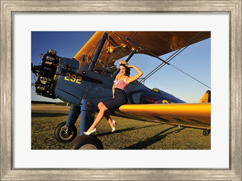 Framed 1940&#39;s style pin-up girl sitting on the wing of a Stearman biplane Print