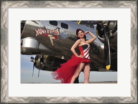 Framed Beautiful 1940&#39;s style pin-up girl standing under a B-17 bomber Print