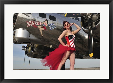 Framed Beautiful 1940&#39;s style pin-up girl standing under a B-17 bomber Print