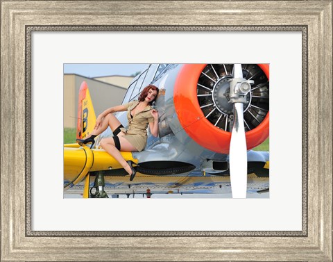 Framed 1940&#39;s style pin-up girl posing on a T-6 aircraft Print