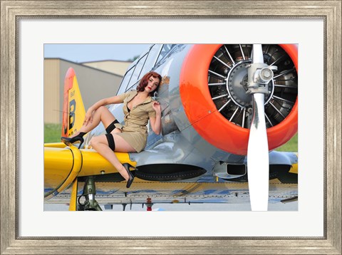 Framed 1940&#39;s style pin-up girl posing on a T-6 aircraft Print
