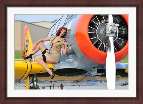 Framed 1940&#39;s style pin-up girl posing on a T-6 aircraft Print