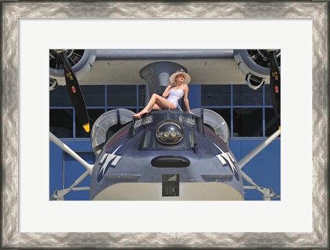 Framed Retro pin-up girl posing with a World War II era PBY Catalina seaplane Print