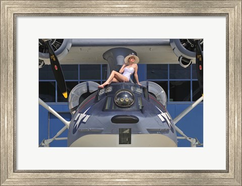 Framed Retro pin-up girl posing with a World War II era PBY Catalina seaplane Print