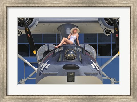 Framed Retro pin-up girl posing with a World War II era PBY Catalina seaplane Print