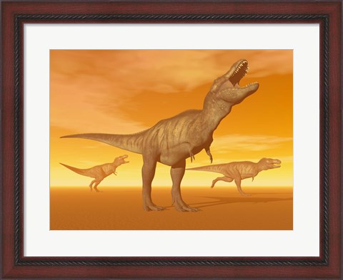 Framed Tyrannosaurus Rex dinosaurs in an orange foggy desert by sunset Print
